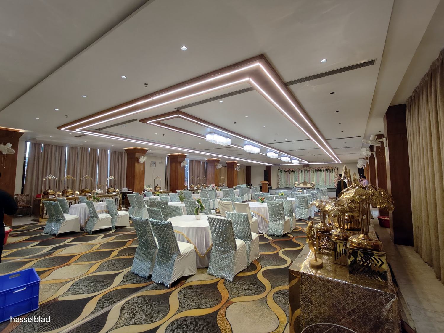 Banquet hall with chandeliers and set tables