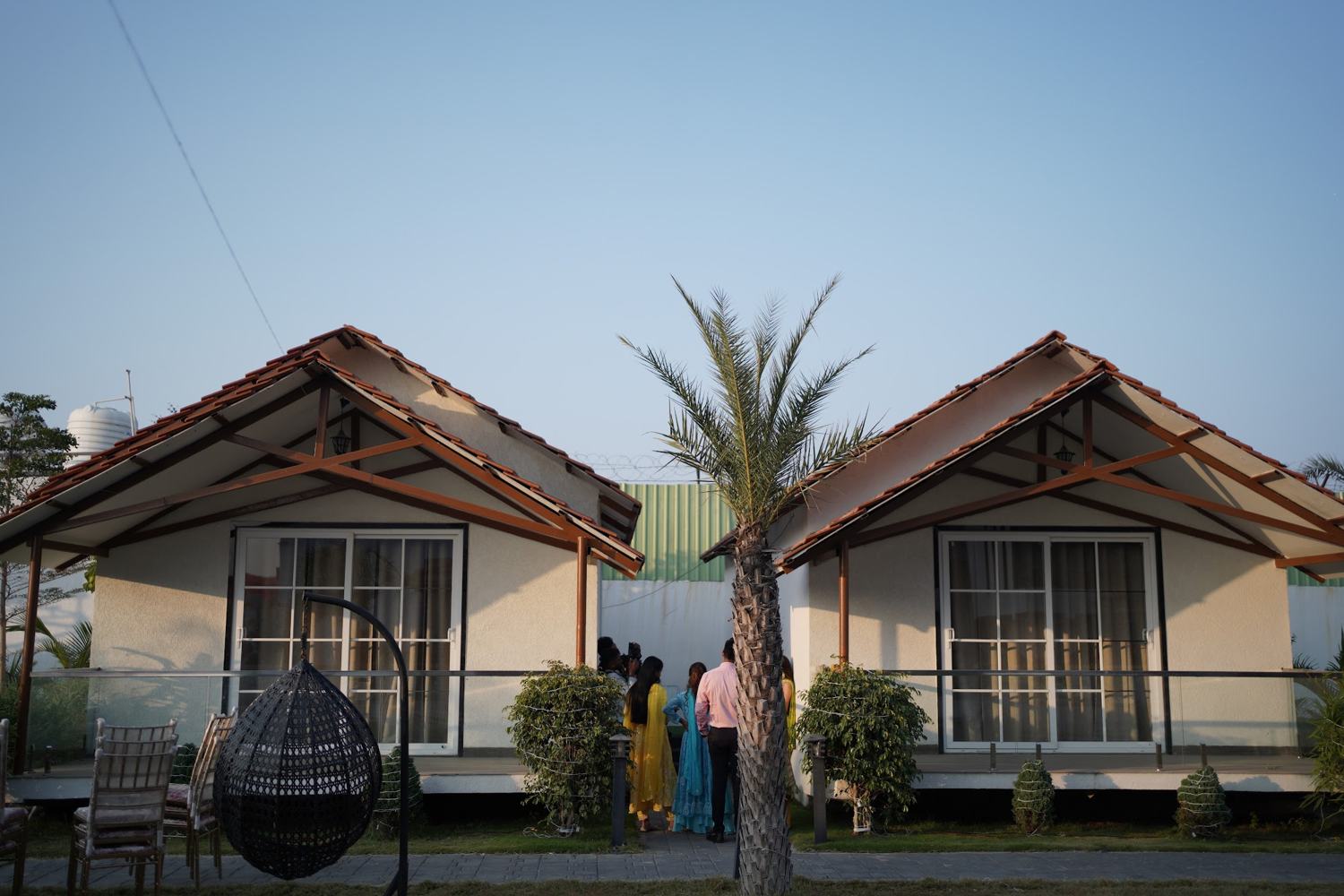 Two garden cottages with palms