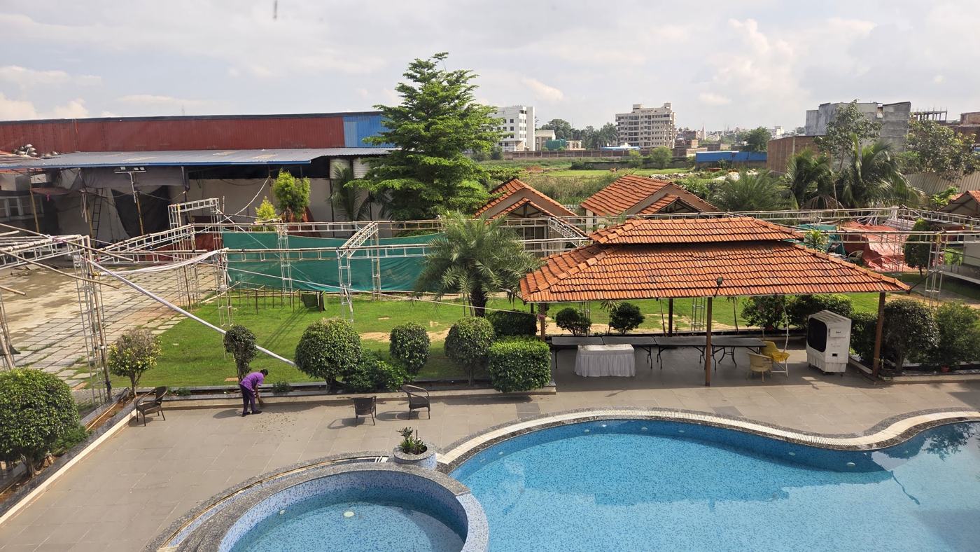 Lawn, cottages and pool seen from above
