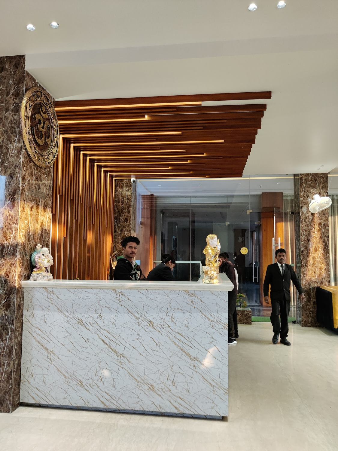 Reception with timber slat ceiling and marble desk