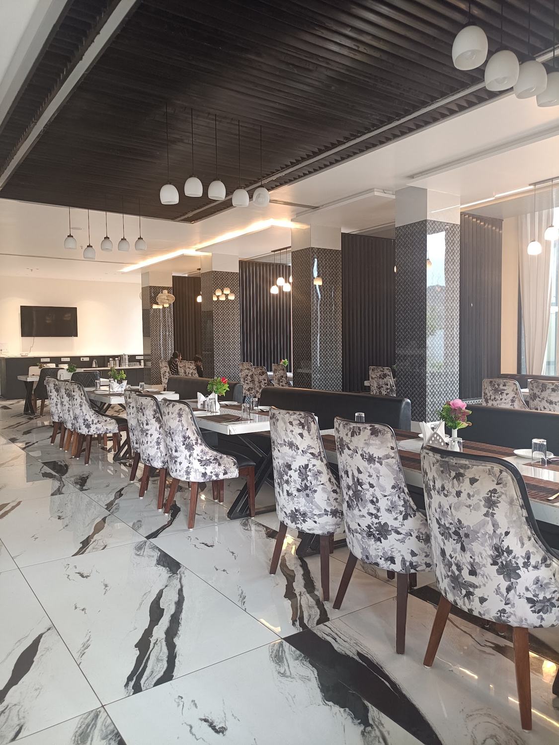 Restaurant floor with marble and printed chairs