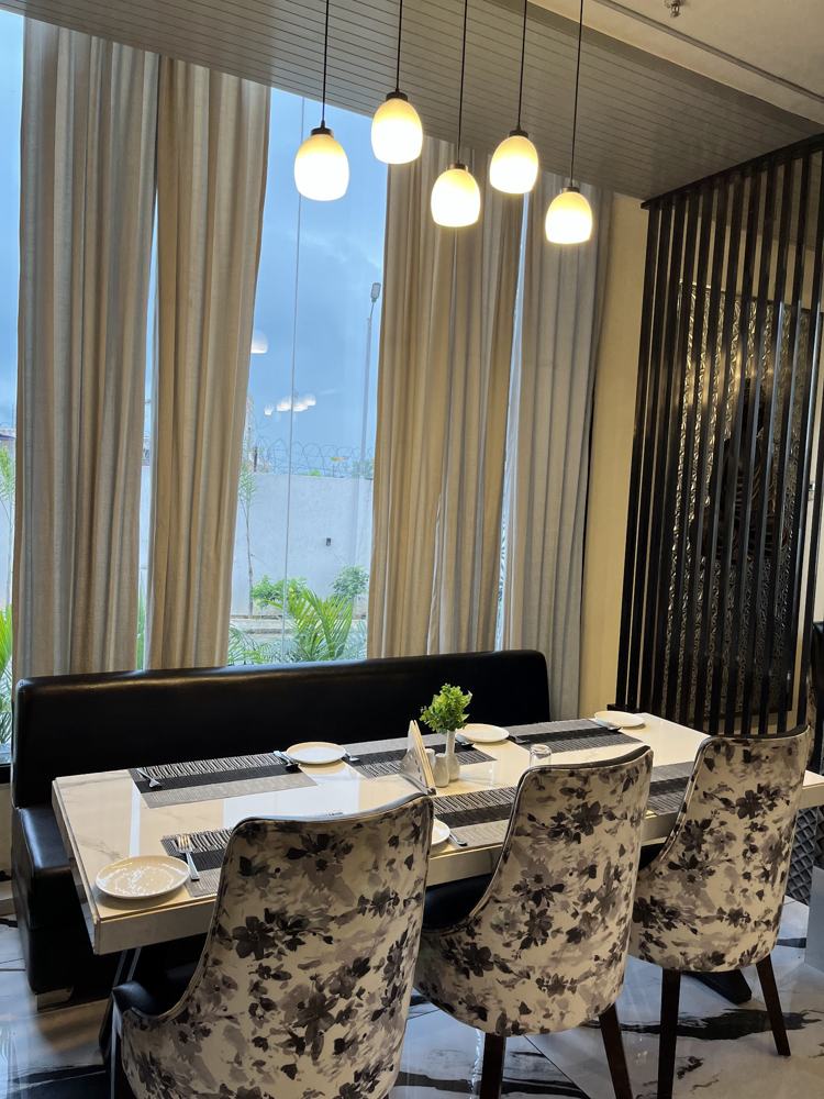 Restaurant seating by tall windows