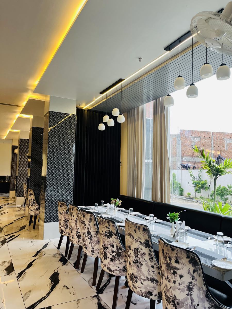 Restaurant with pendant lights and patterned chairs
